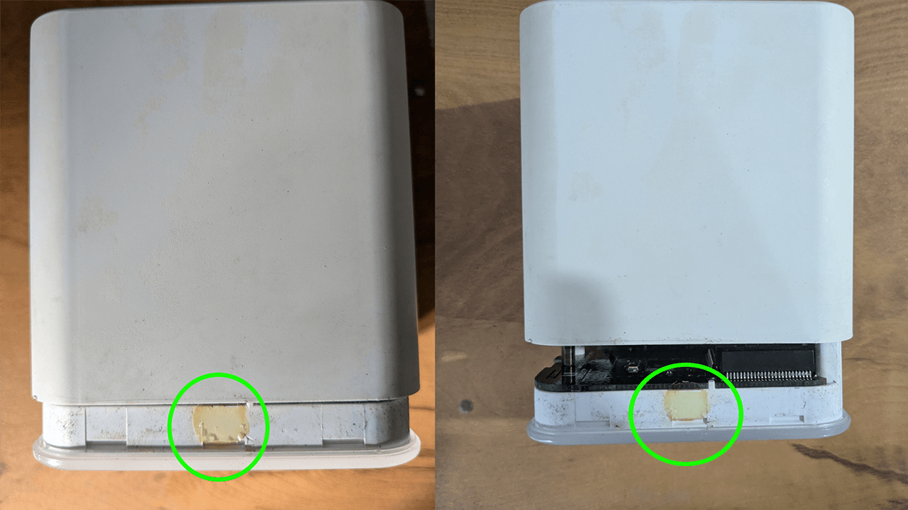 Amplifi HD Router after clips have been loosened separating the translucent base from the white housing above